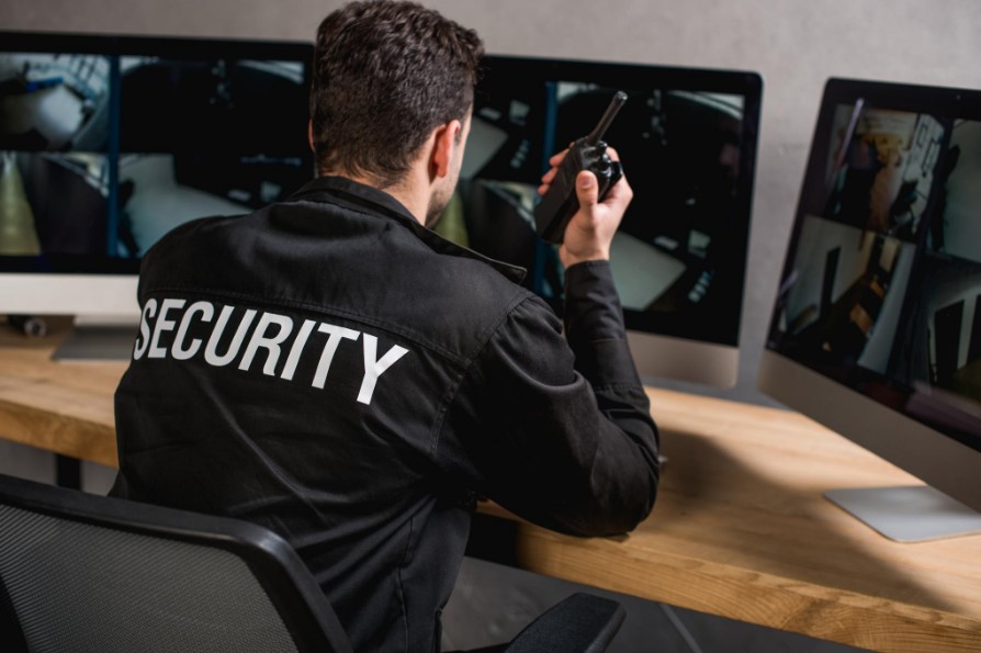 security guard watching monitors