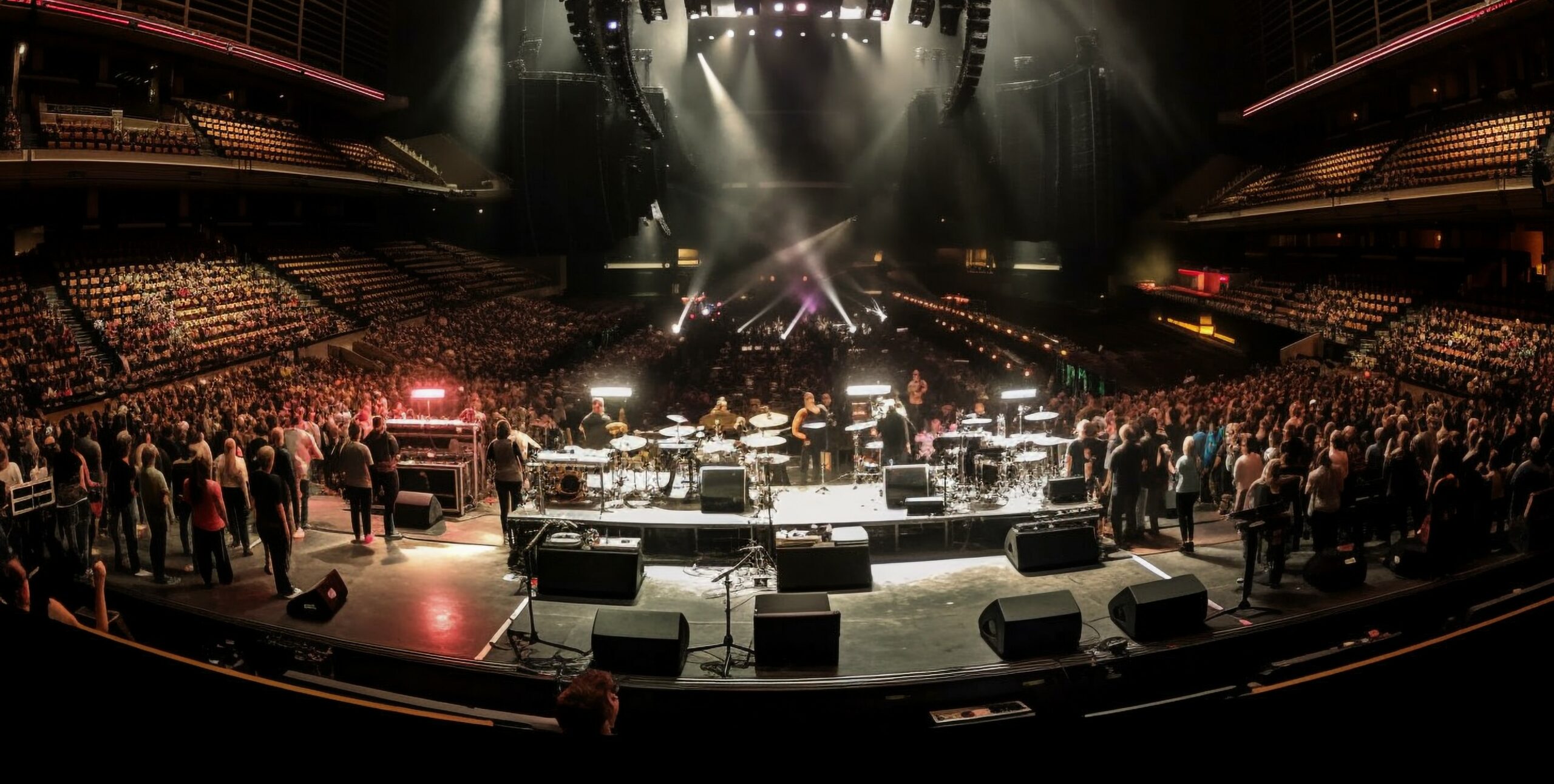 Large crowd at rock concert under bright lights generated by AI