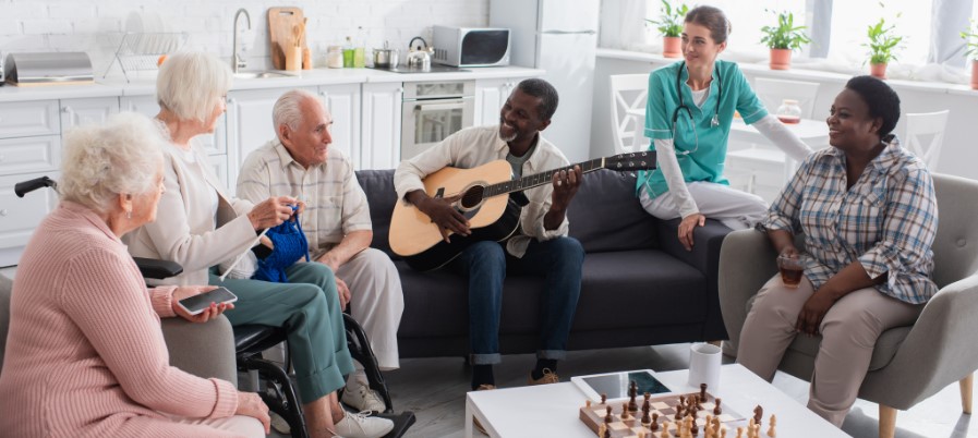 seniors in a nursing home listening to music