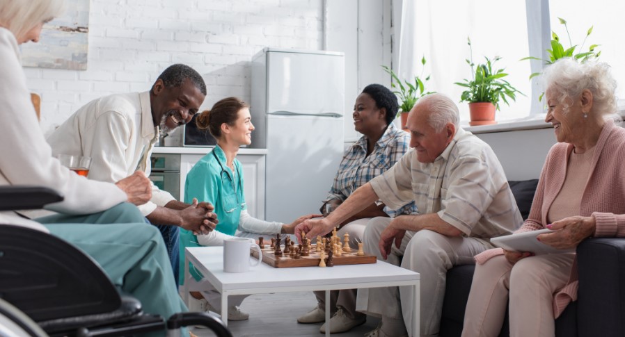 seniors playing chess in a nursing home