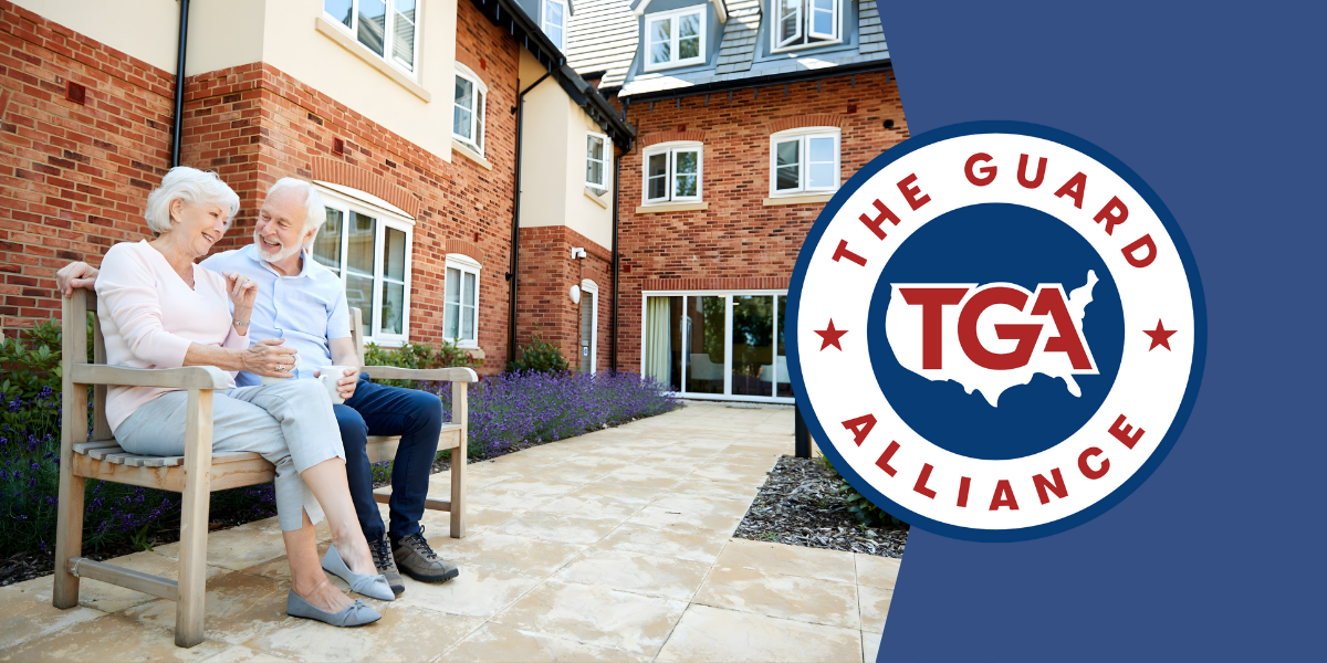 Senior couple in front of building and TGA logo